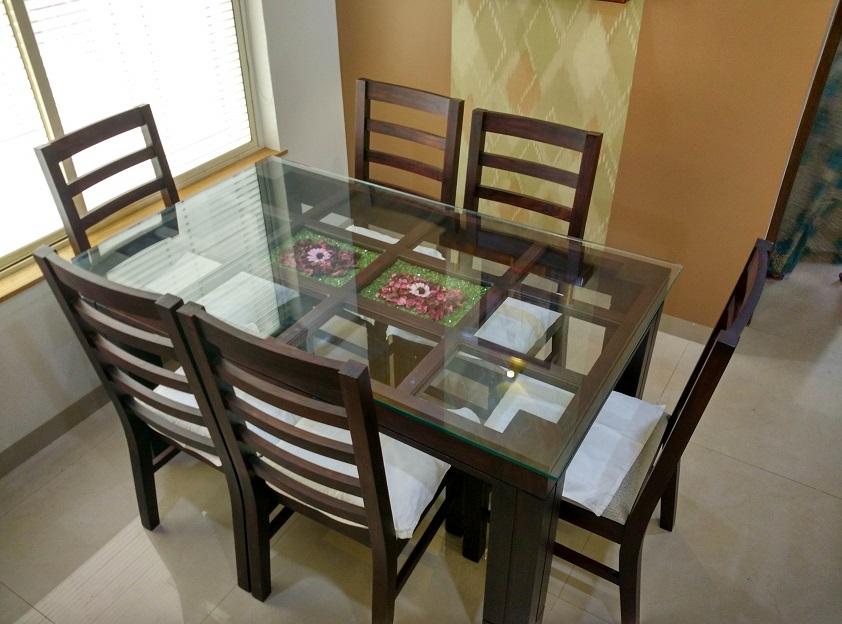 Glass top dining table with online chairs